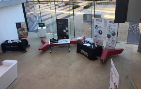 Photo of the Centre Building displaying exhibitions stands for Roslin Innovation Centre tenant showcase