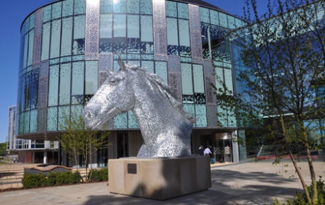 photo of the exterior of Roslin Innovation Centre, Easter Bush Campus with Canter horse statue in foreground - credit Roslin Innovation Centre