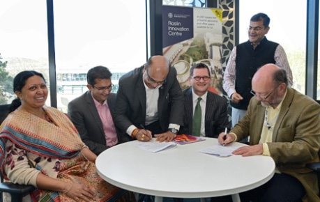 Dr Taslimarif Saiyed, CCAMP signing Letter of Intent at Roslin Innovation Centre in presence of Dr. Renu Swarup, Secretary DBT and MD Biotechnology Industry Research Assistance Council (BIRAC) - credit UoE