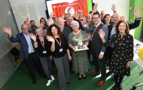 Roslin Innovation Centre celebrating 2 years of business with cake shared with tenants in the open-plan office