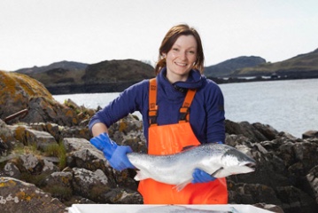 Fish worker with salmon for Aquaculture - A3 Scotland 2020 conference