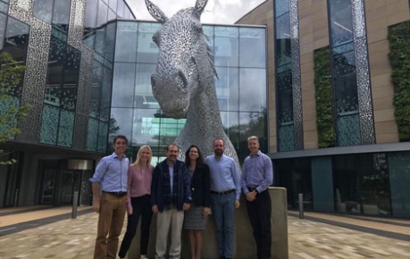 AskBio team outside Roslin Innovation Centre by Canter sculpture