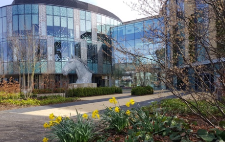 Roslin Innovation Centre exterior with Canter statue and spring daffodils - credit Roslin Innovation Centre