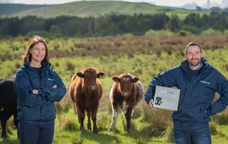 Dr Tiffany Wood of Dyneval in field with cattle, showcasing Dynescan product